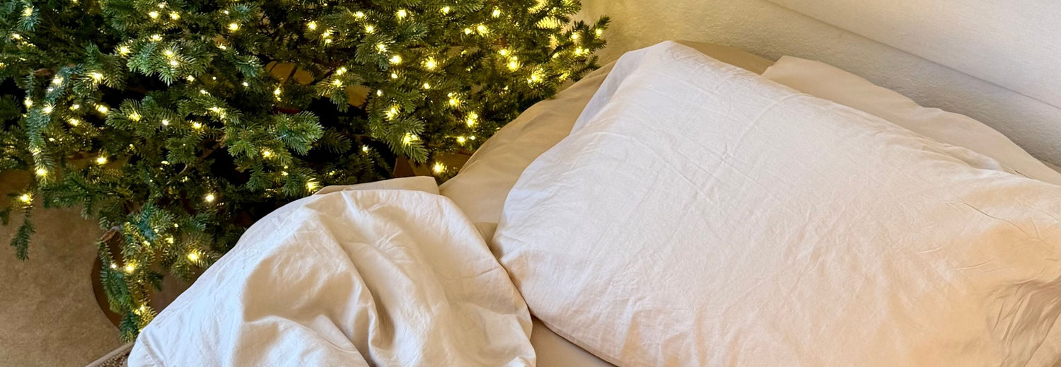 organic bedding next to a christmas tree