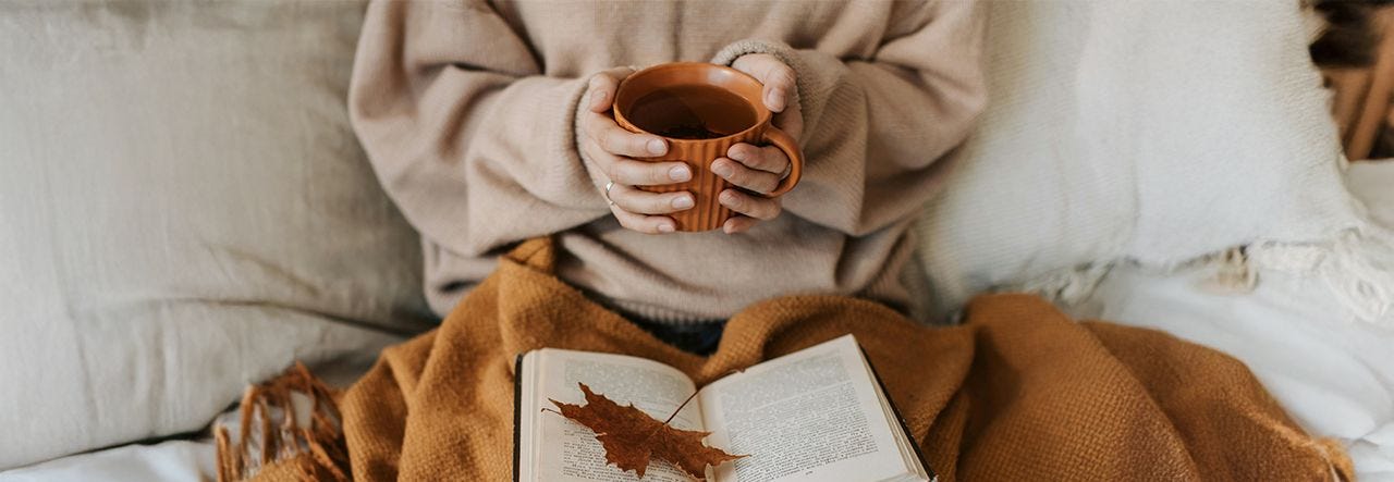 Hands holding cup of coffee