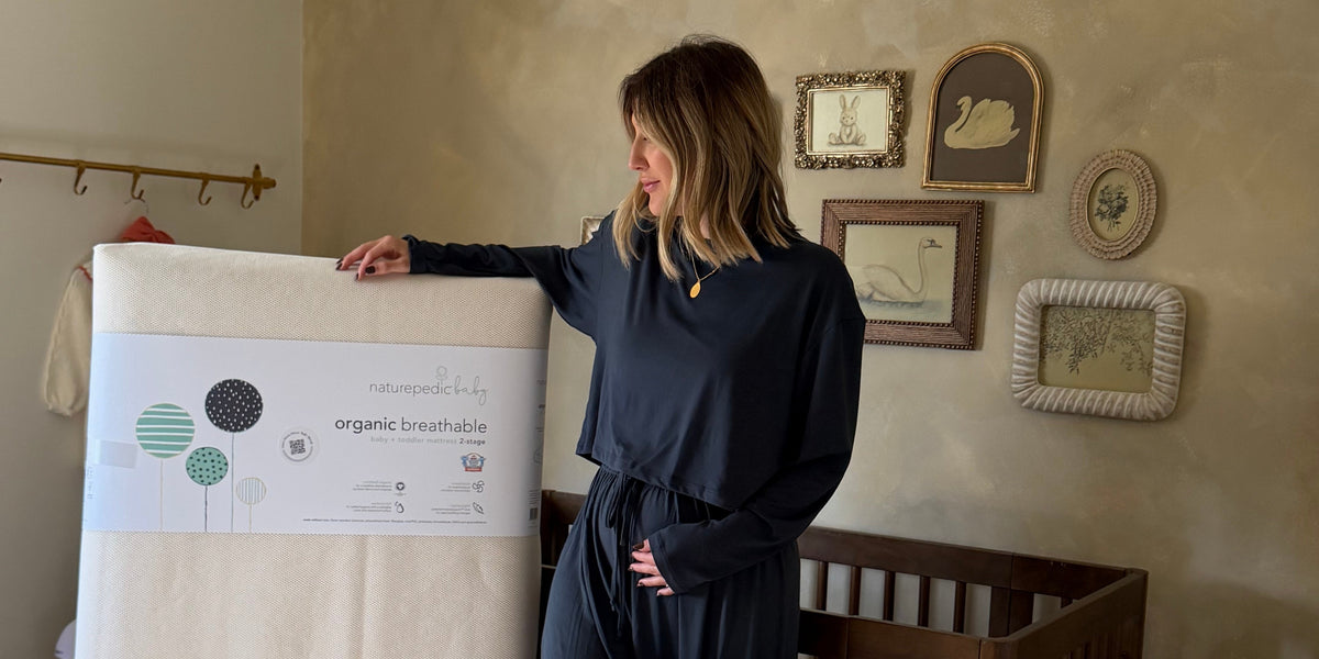 woman with organic mattress in organic baby nursery