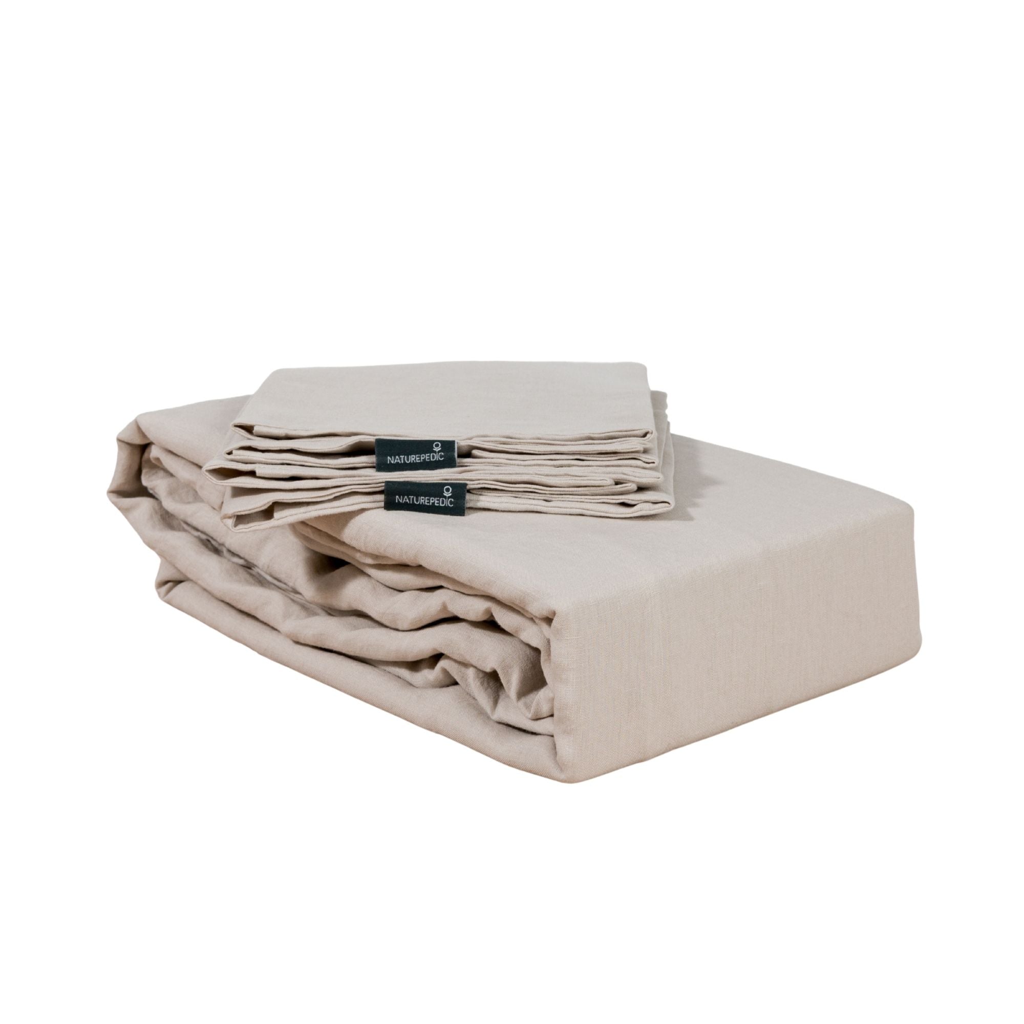 Folded linen duvet cover and shams against a white background #color_beige