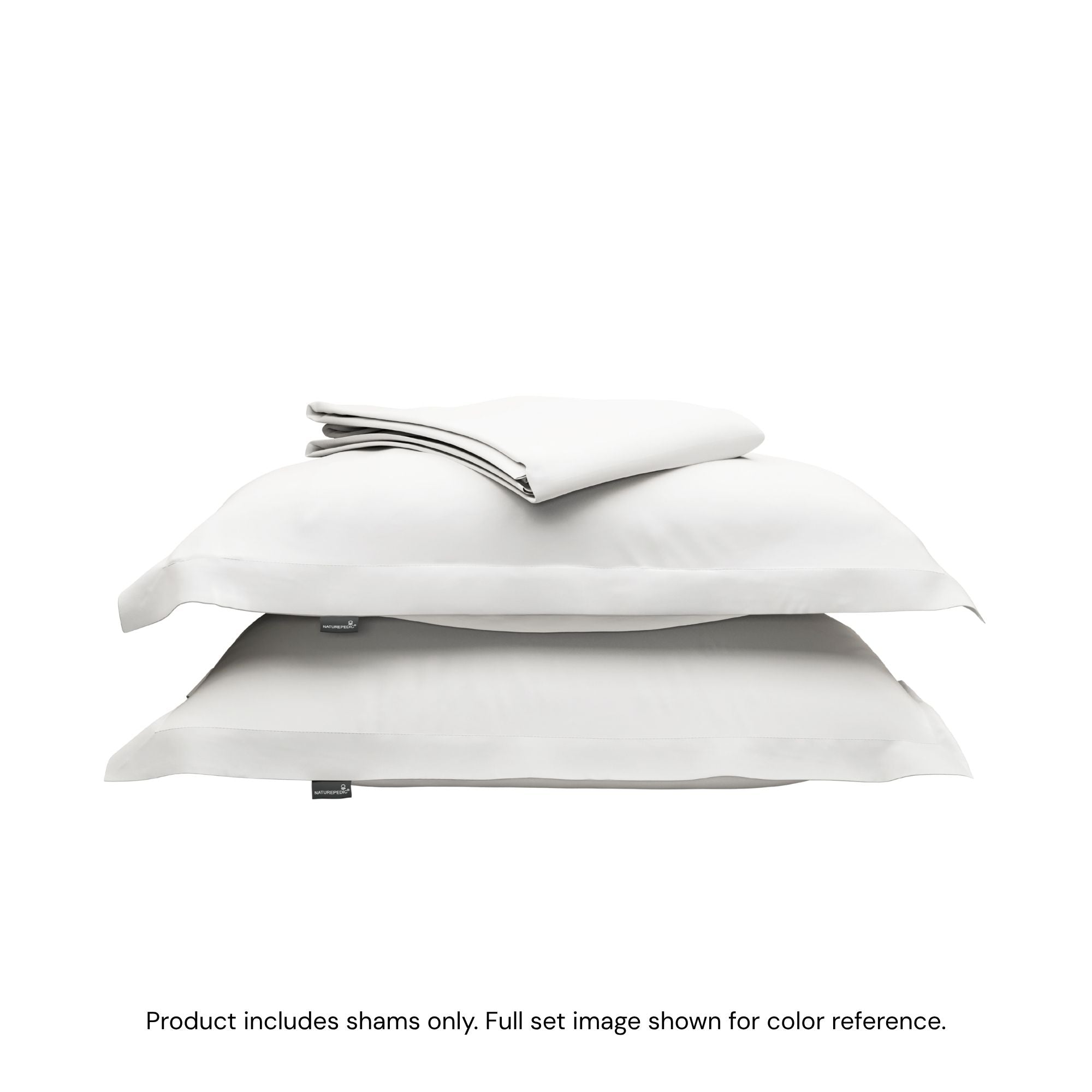 A folded duvet cover on top of two pillow shams. #color_