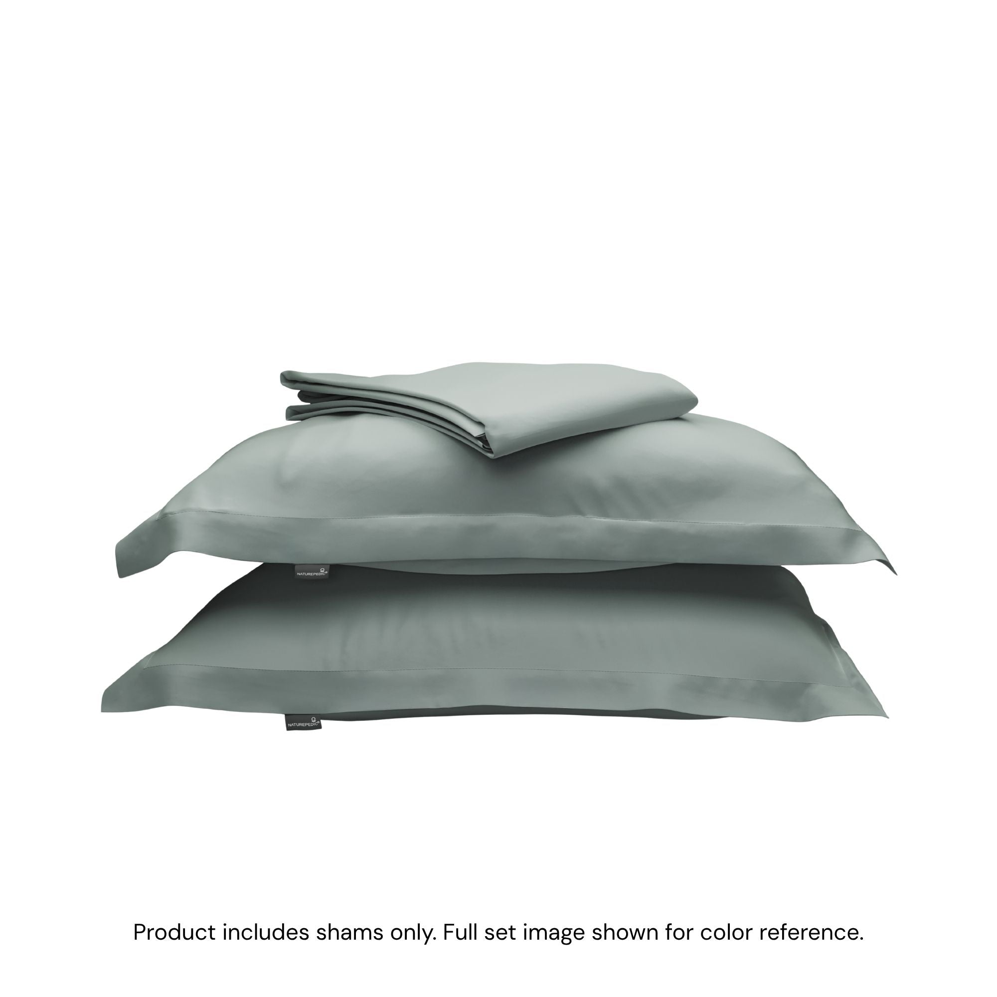 A folded duvet cover on top of two pillow shams. #color_harbor island