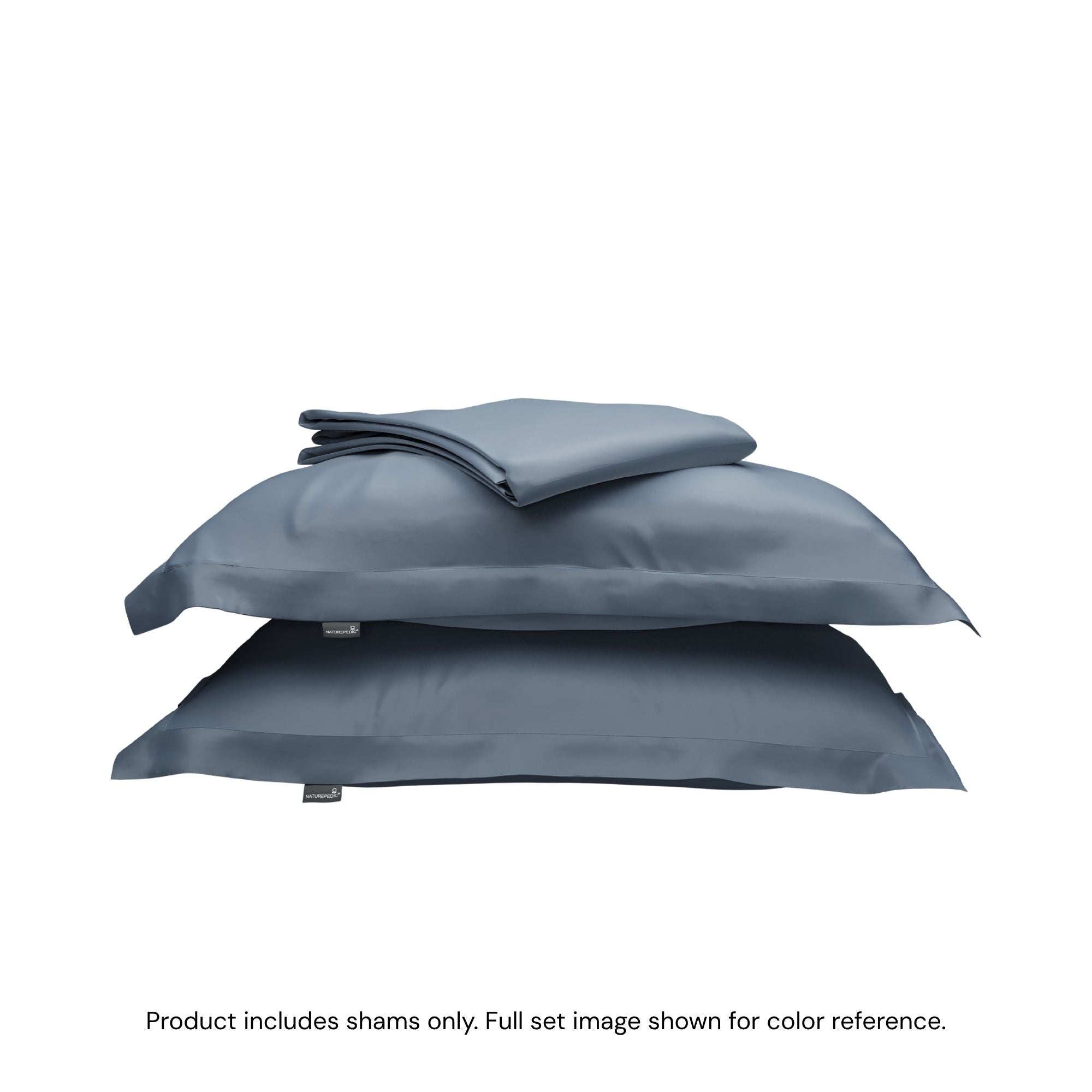 A folded duvet cover on top of two pillow shams. #color_mineral blue