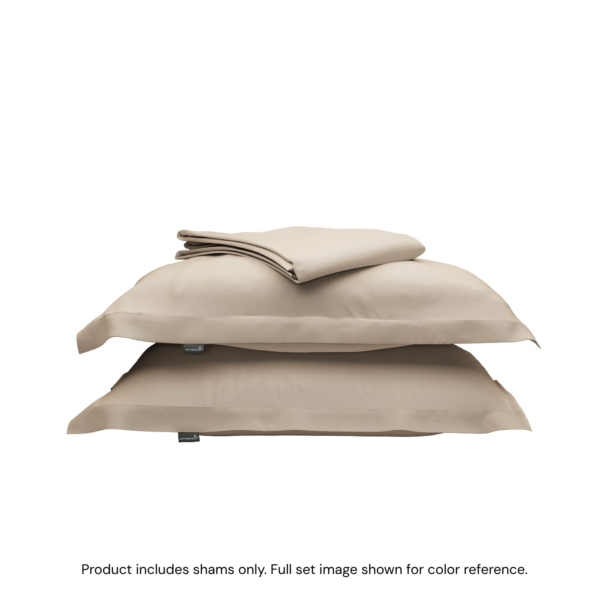 A folded duvet cover on top of two pillow shams. #color_sand
