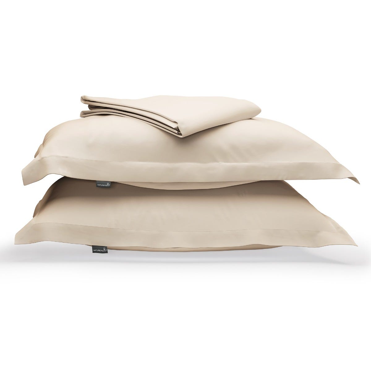 Beige duvet cover folded on top of two matching shams against a white background #color_undyed