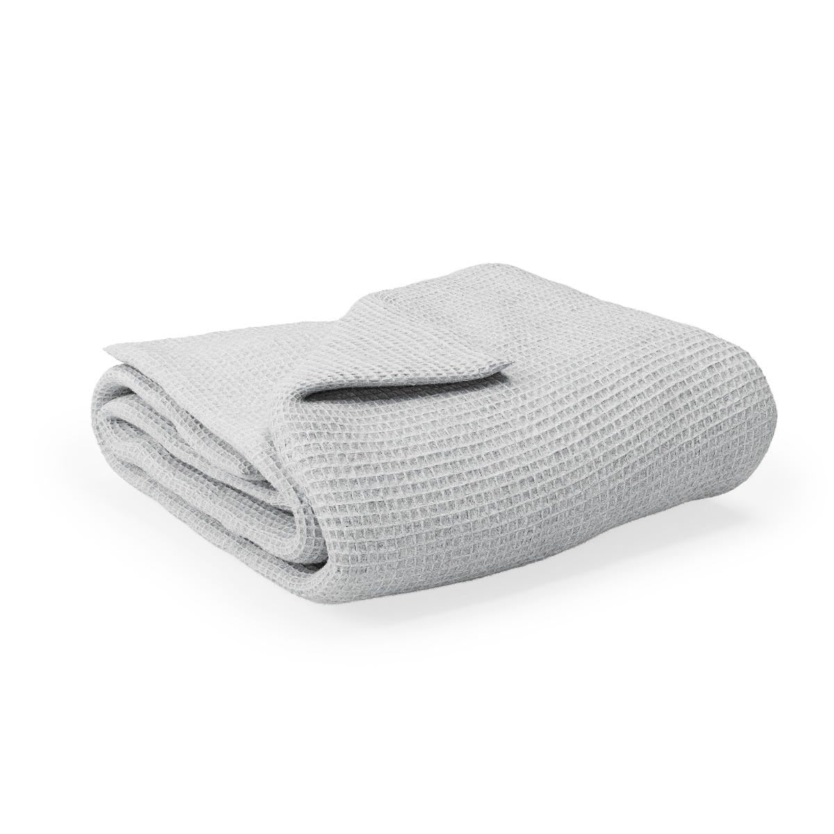 Folded waffle blanket on a white background #color_mist
