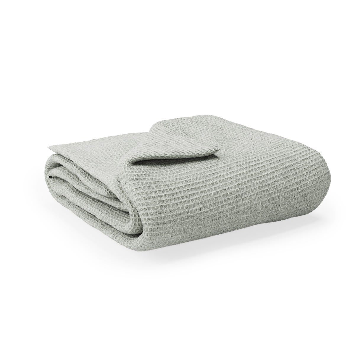Folded waffle blanket on a white background #color_sage