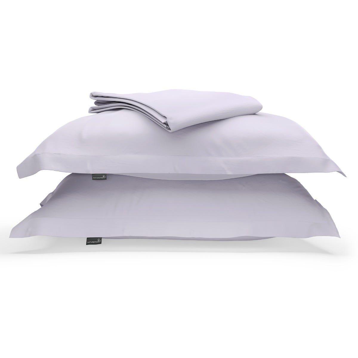 A duvet cover folded on top of two pillow shams against a white background #color_wild bergamot