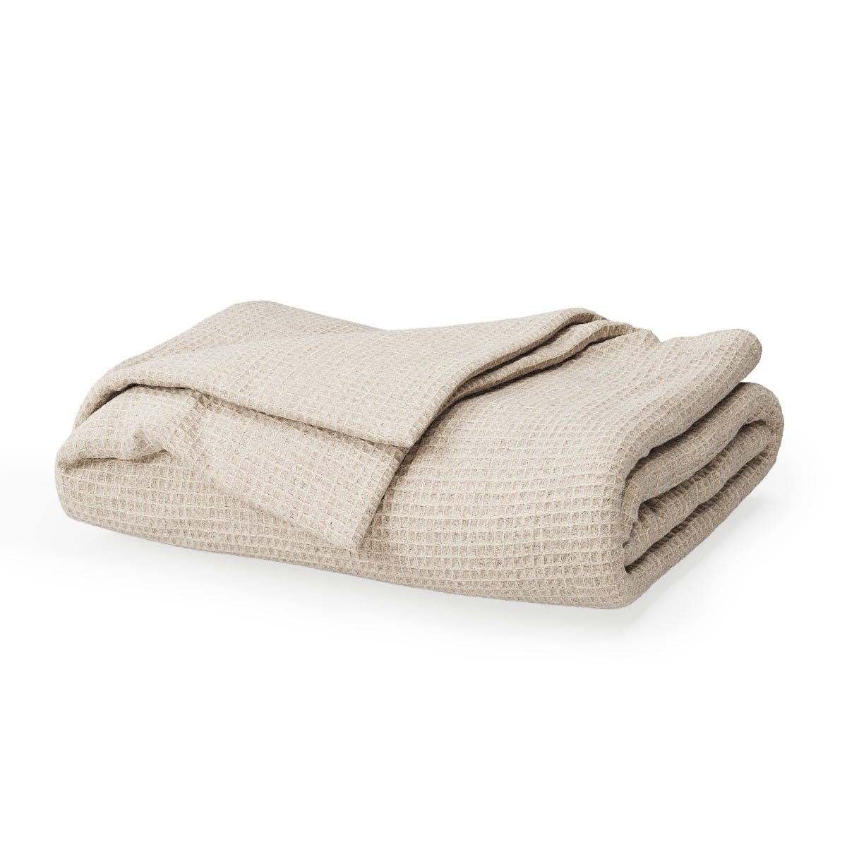 Folded beige blanket on a white background #color_sand