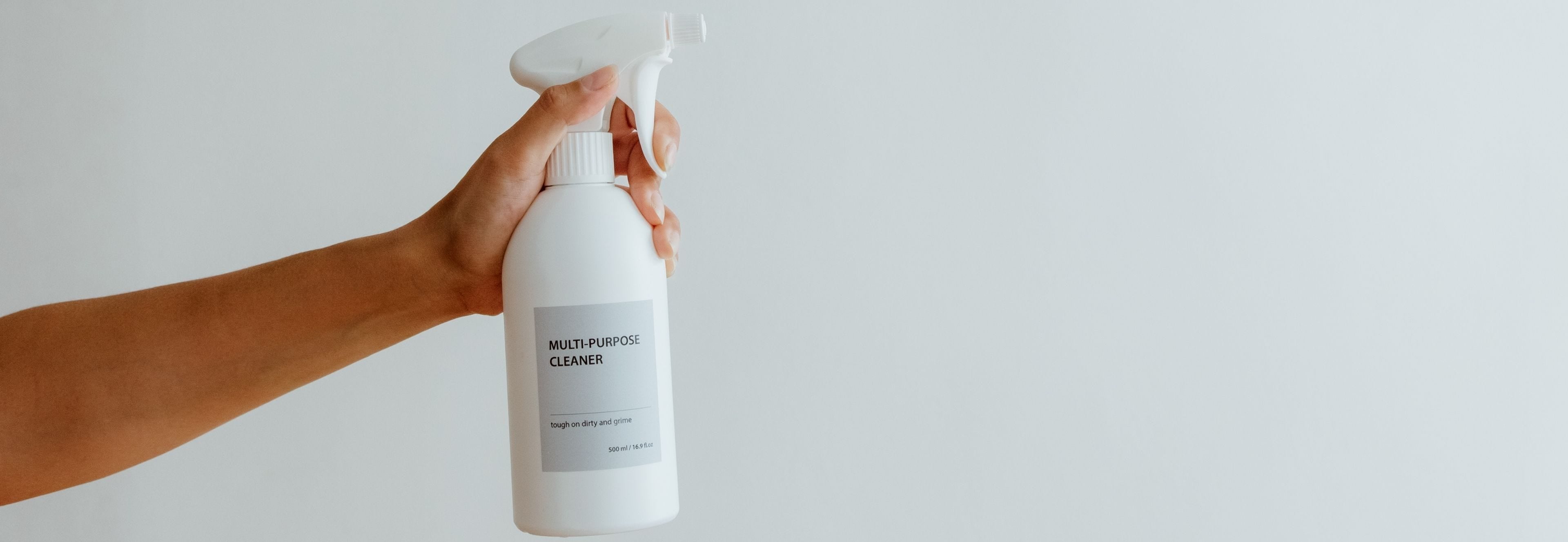 hand holding multi purpose cleaning solution