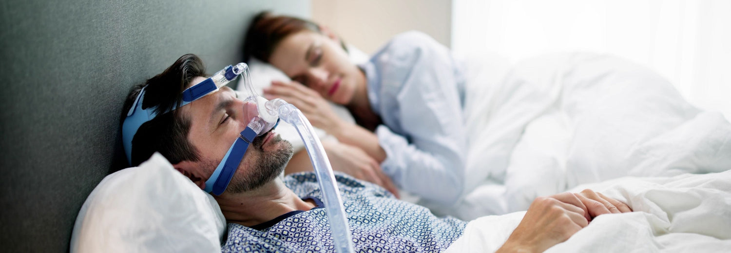 man with sleep apnea sleeping with CPAP