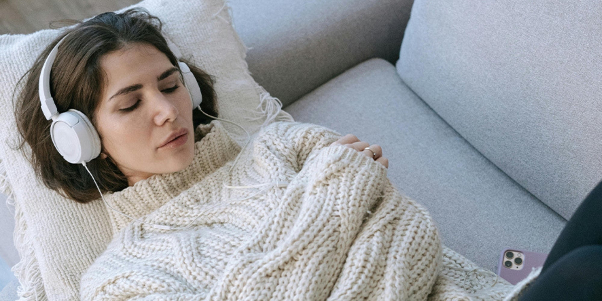 woman sleeping with headphones on