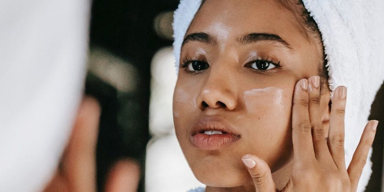 woman applying face cream