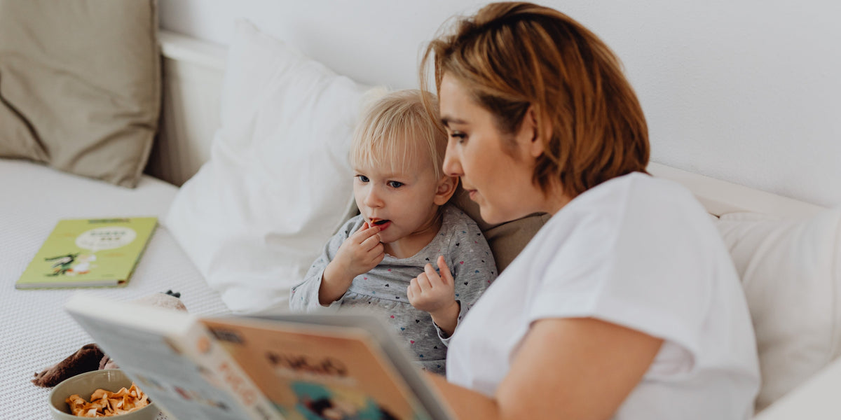 Parent reading bedtime story to child