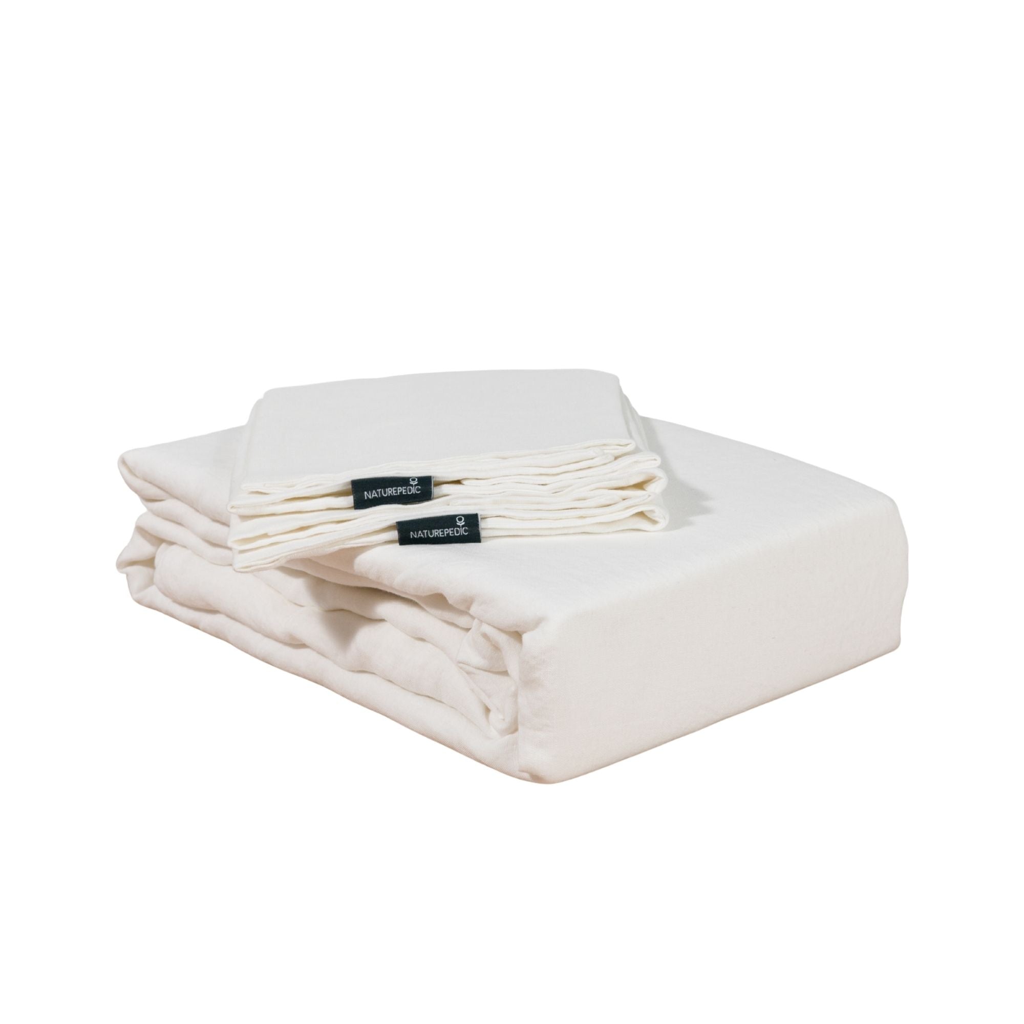 Folded linen duvet cover and shams against a white background #color_arctic snow