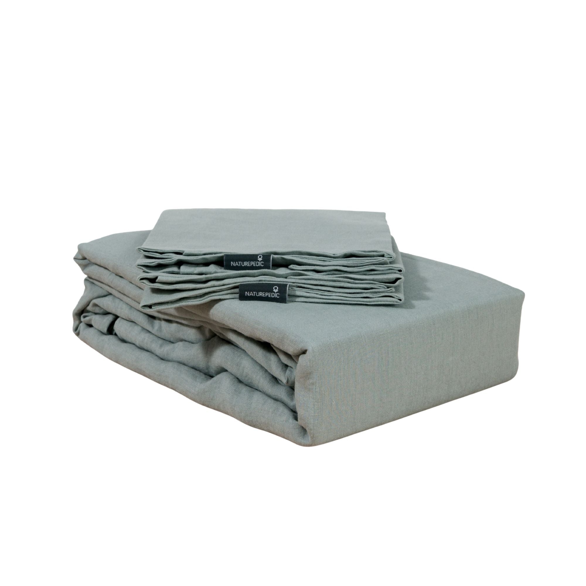 Folded linen duvet cover and shams against a white background #color_harbor island