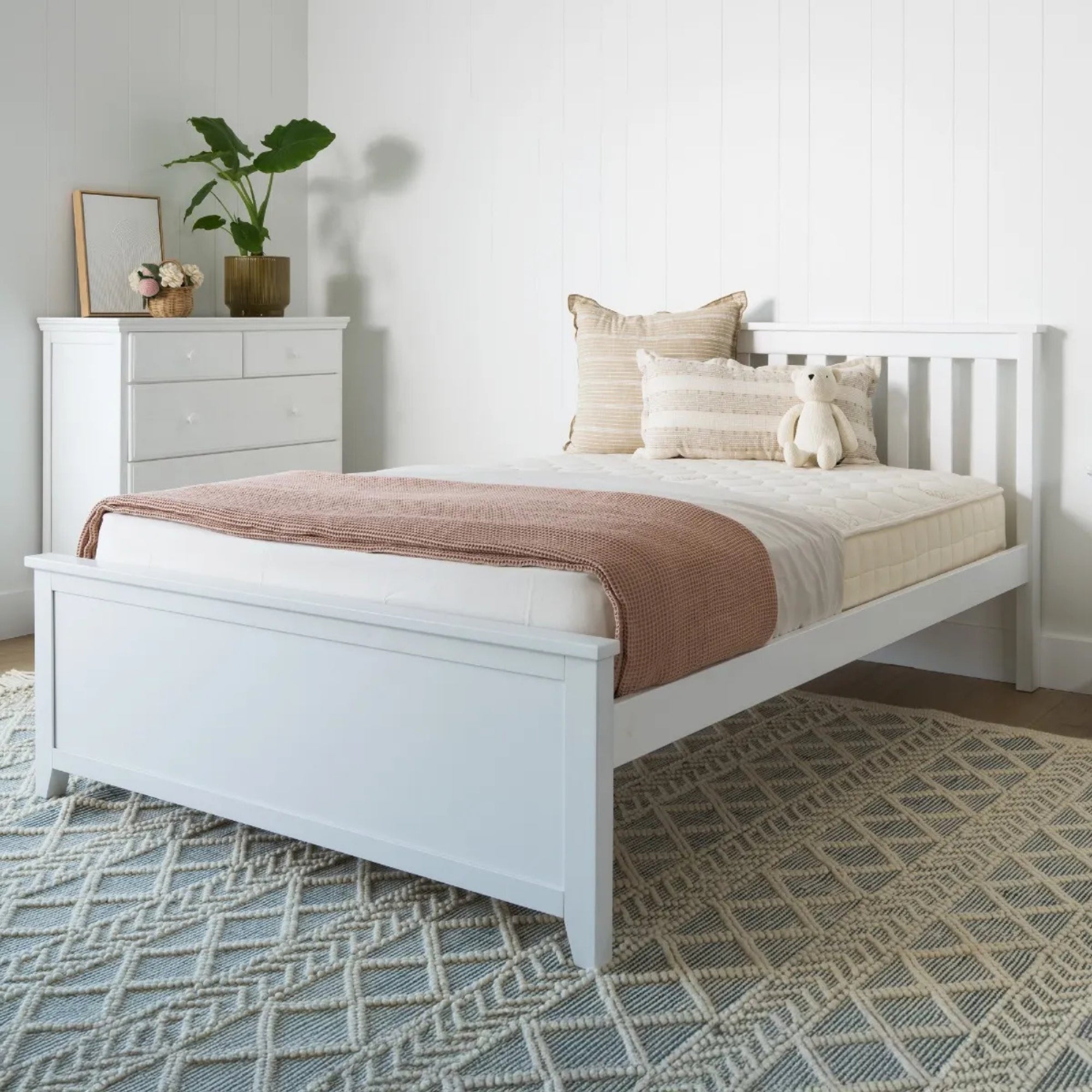White bedroom with a bed, dresser, and decorative items. #size_Full Platform  #color_washed white 