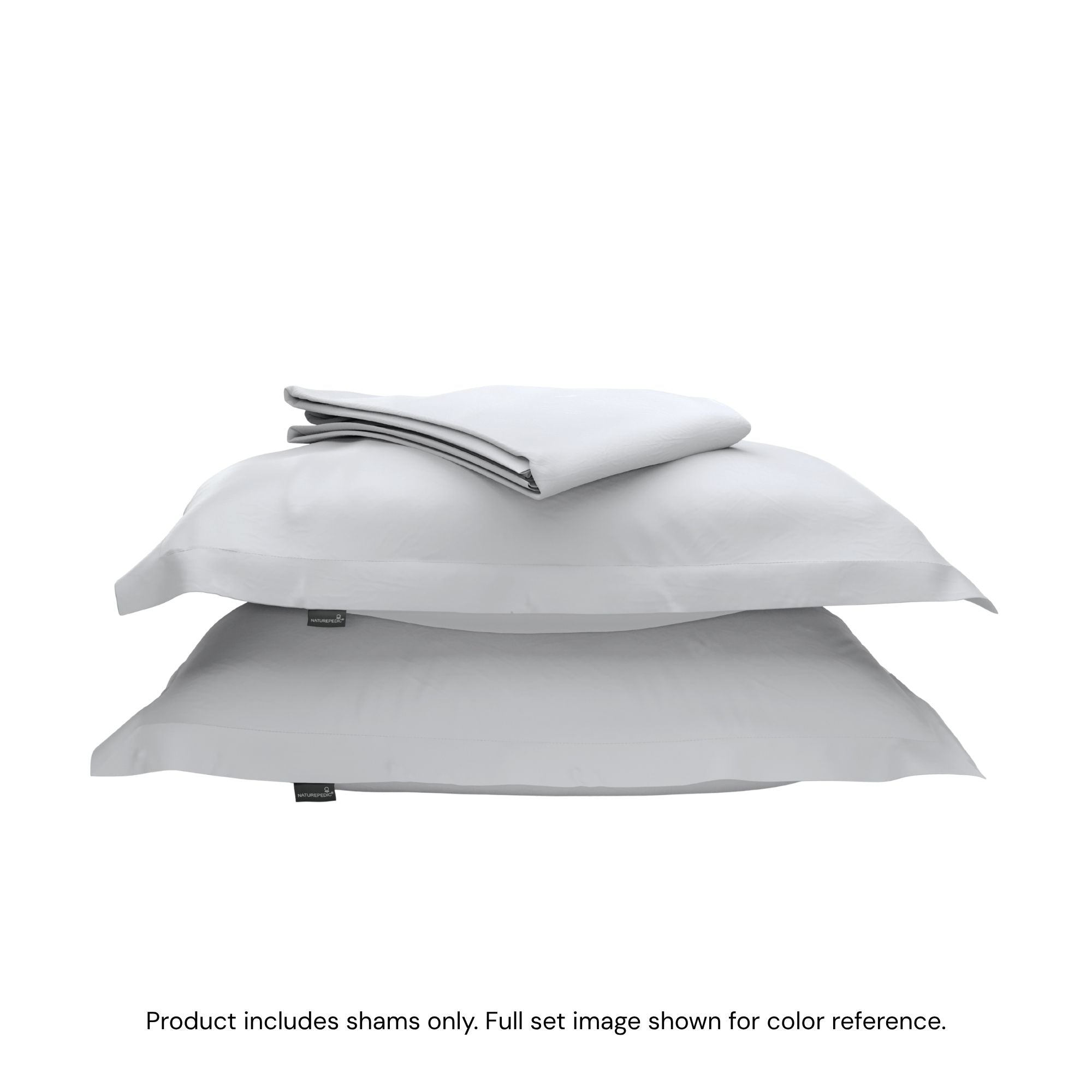 A duvet cover folded on top of two pillow shams #color_mist