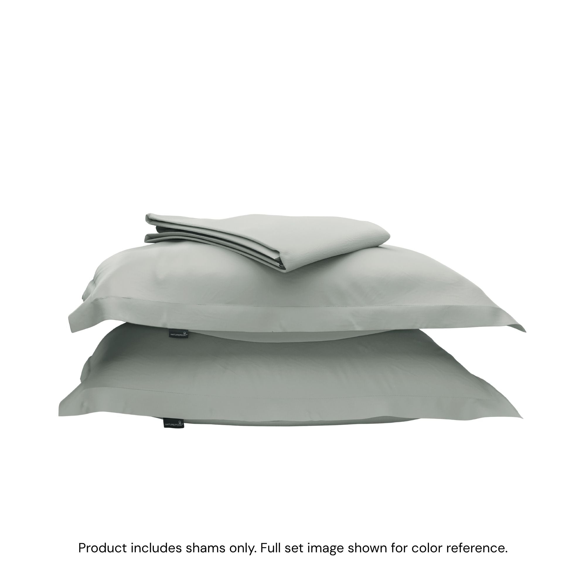A duvet cover folded on top of two pillow shams #color_sage