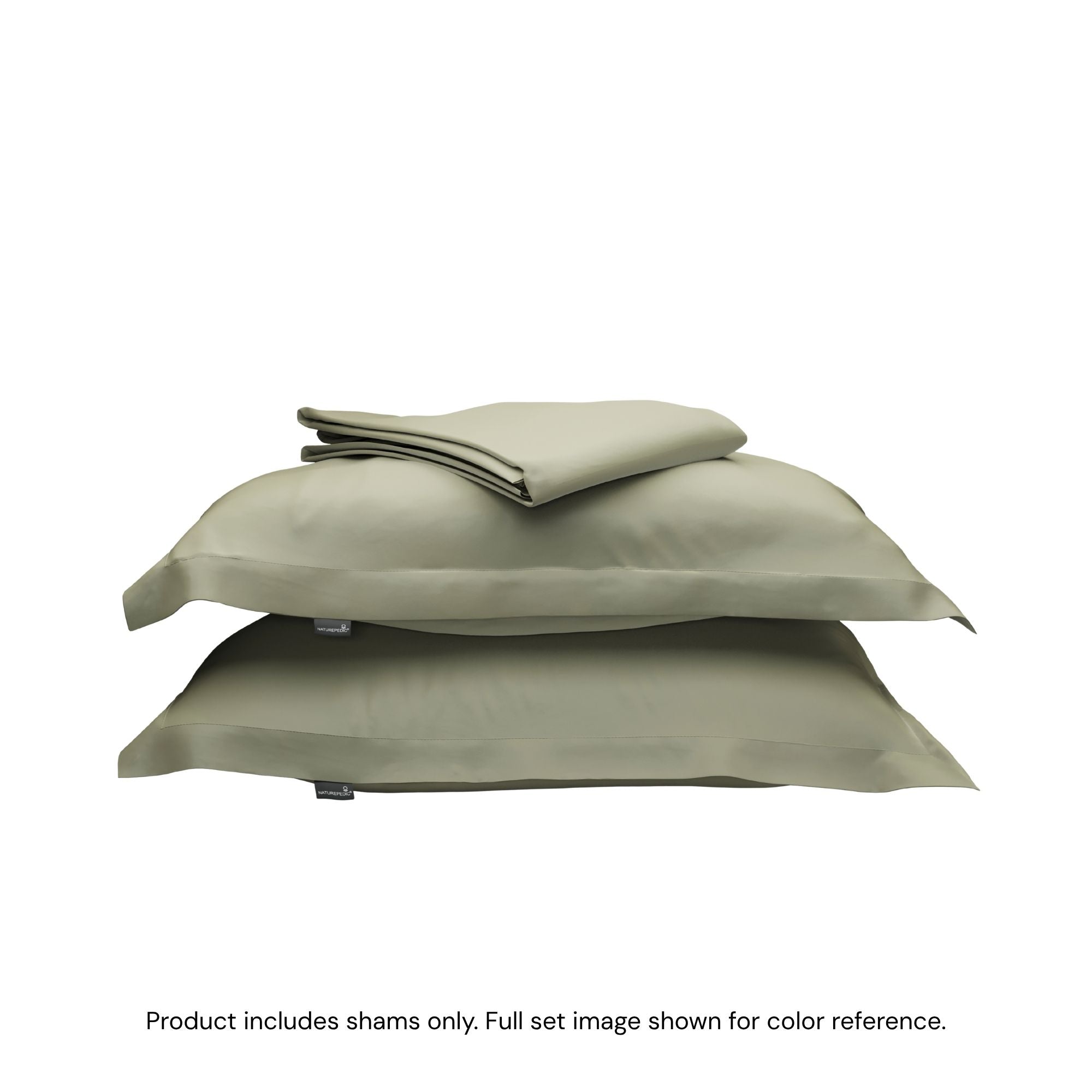 A folded duvet cover on top of two pillow shams. #color_forest canopy