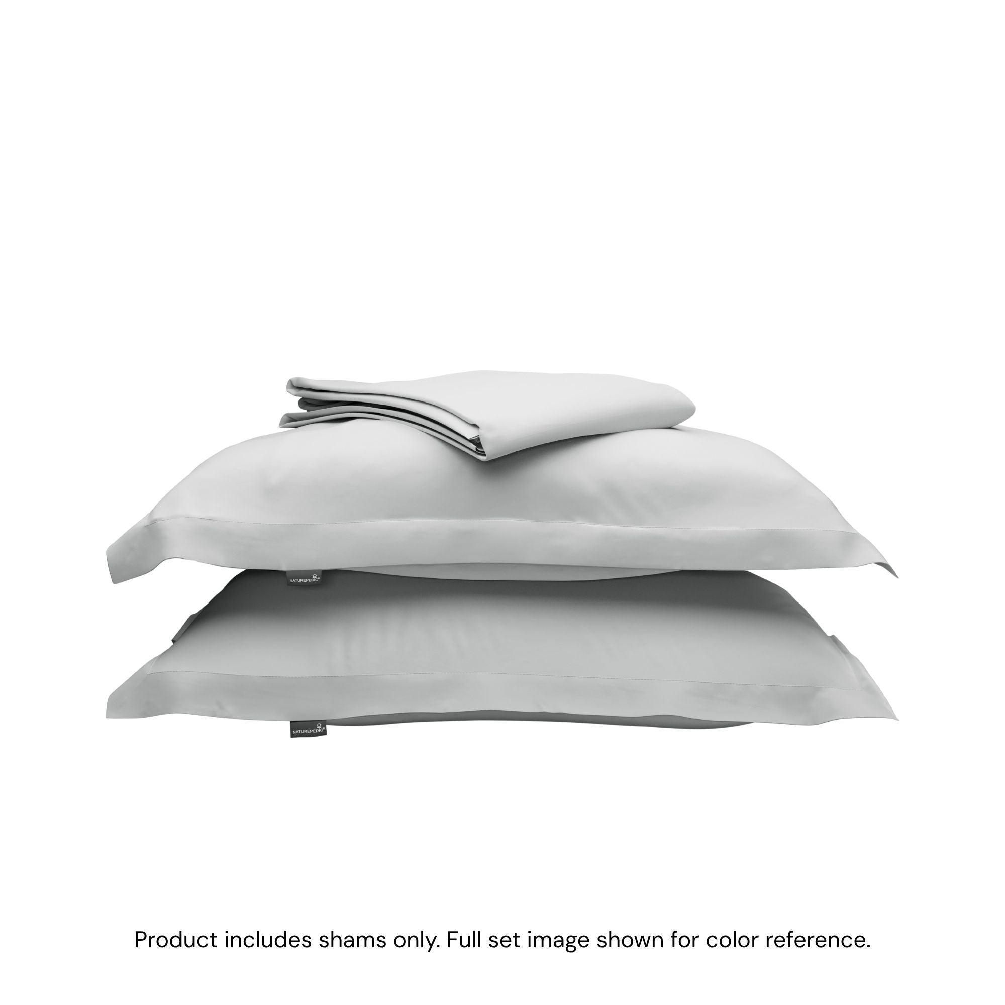 A folded duvet cover on top of two pillow shams. #color_mist