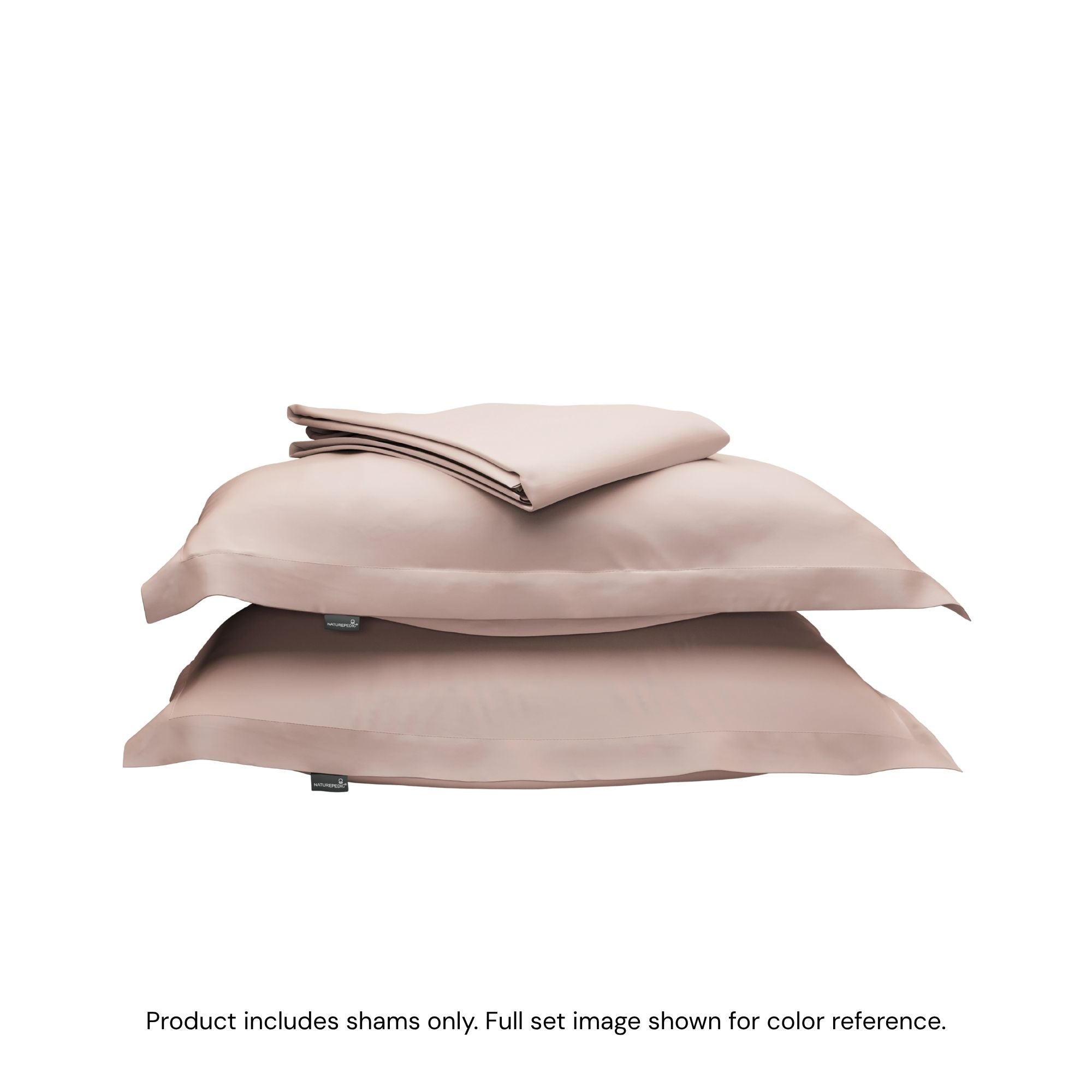 A folded duvet cover on top of two pillow shams. #color_petal