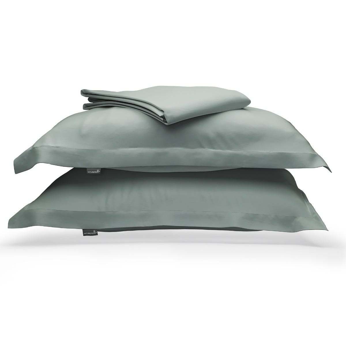 Teal duvet cover folded on top of two matching shams against a white background #color_harbor island
