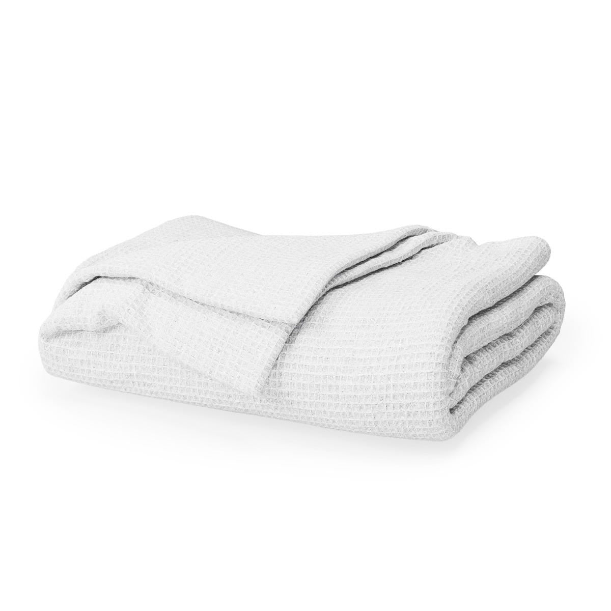 Folded white blanket on a white background #color_arctic snow