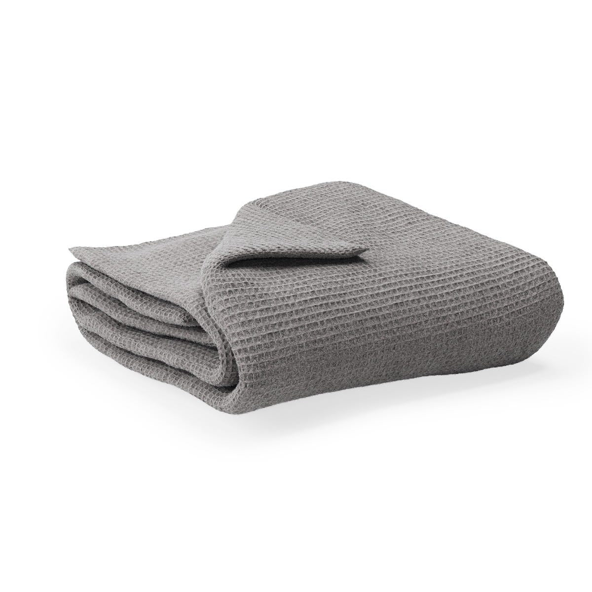 Folded waffle blanket on a white background #color_pebble grey