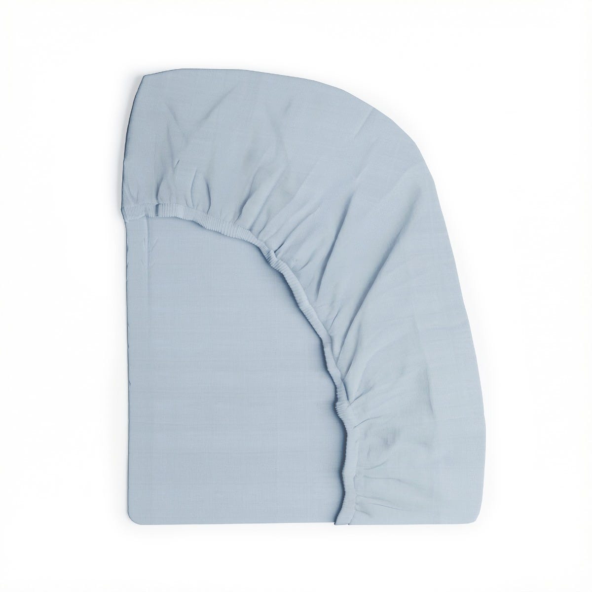 Fitted sheet folded against a white background #color_washed cornflower