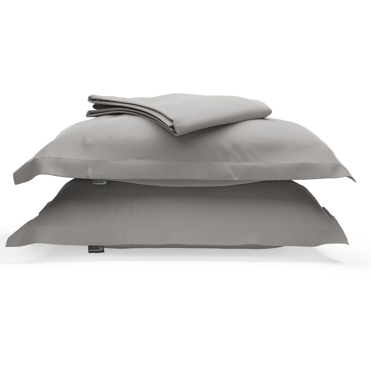 A duvet cover folded on top of two pillow shams against a white background #color_pebble grey