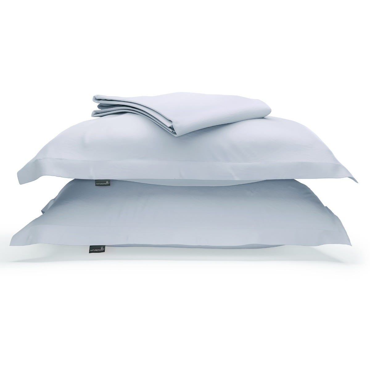 A duvet cover folded on top of two pillow shams against a white background #color_washed cornflower